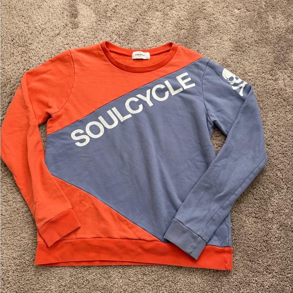 SoulCycle two-color orange and blue crewneck sweatshirt featuring a skull large